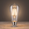 E26 LED filament bulb glowing warm white